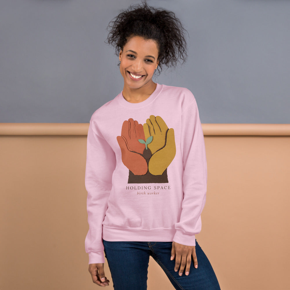 Holding Space birth worker crewneck sweatshirt — Light Pink, on model