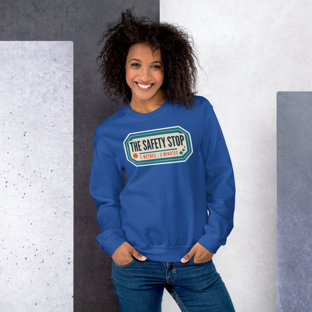 The Safety Stop vintage scuba diving travel decal sweatshirt — Royal, on model