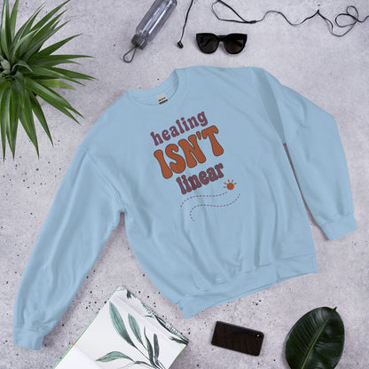 Healing Isn't Linear soft retro mental health crewneck sweatshirt — Light Blue, front angled