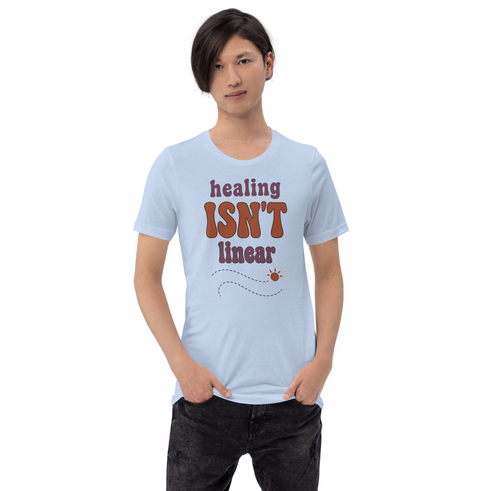 Healing Isn't Linear soft retro mental health tee — Baby Blue, on model