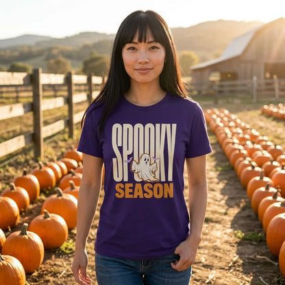 Spooky Season retro Halloween ghost tee — woman in a sunlit pumpkin patch, Team Purple