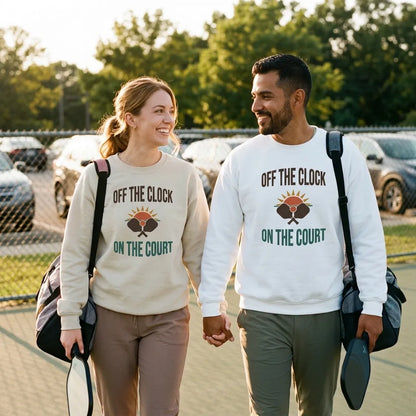 couple walking off pickleball court wearing Off The Clock On The Court retro pickleball crewneck sweatshirt — Light Pink