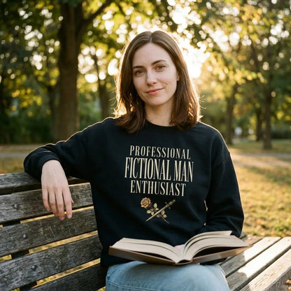 Woman reading on a park bench in a black Professional Fictional Man Enthusiast dark academia crewneck sweatshirt