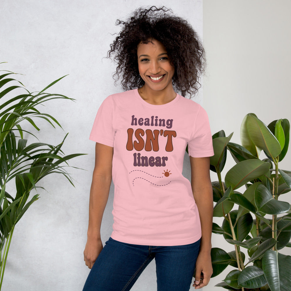 Healing Isn't Linear soft retro mental health tee — Pink, on model
