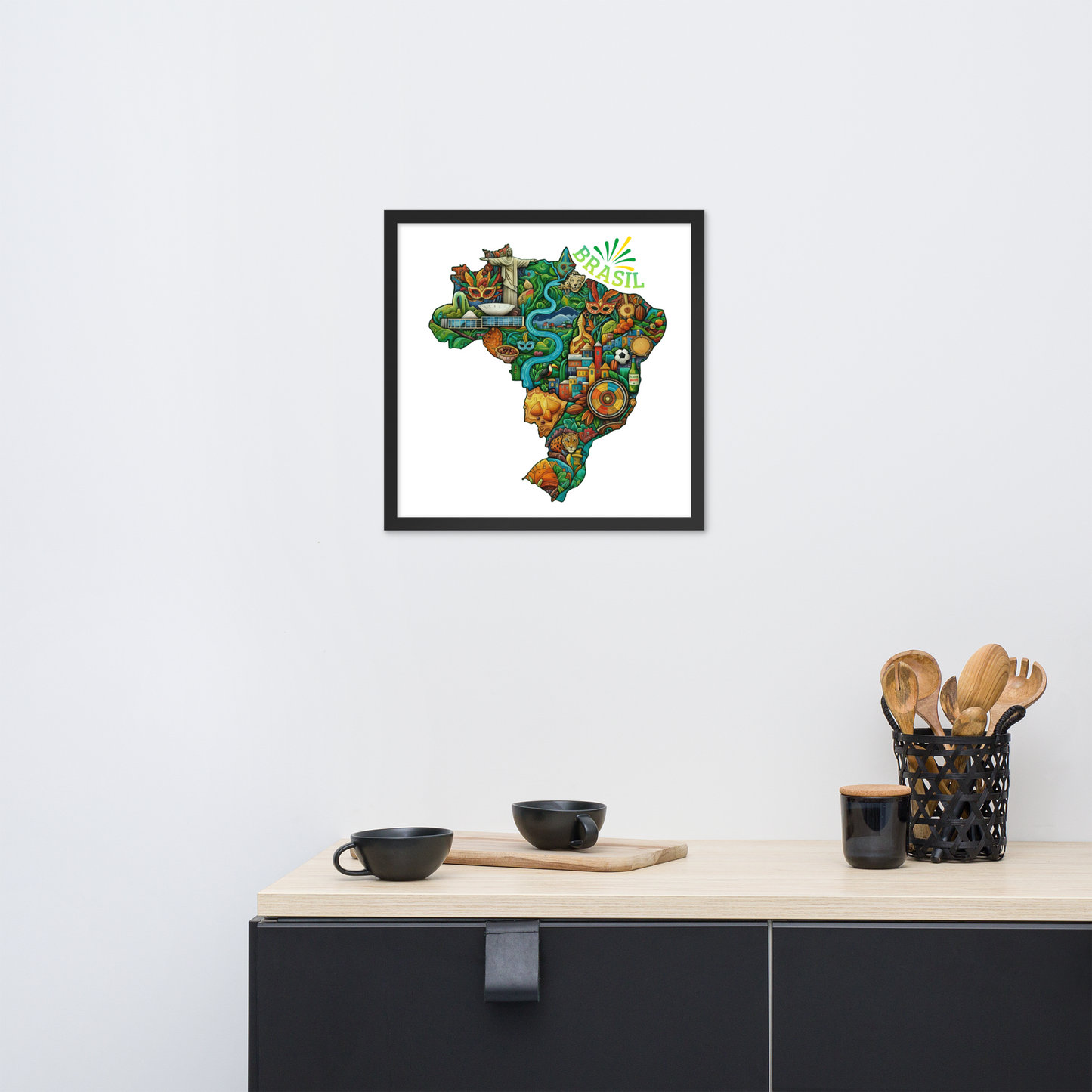 Framed map of Brasil; with indigenous elements on a wall above a kitchen counter.