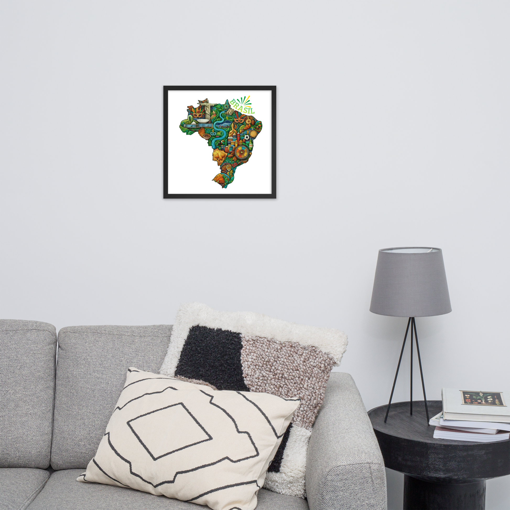Framed artwork of a colorful map of Brasil on a wall above a gray sofa.