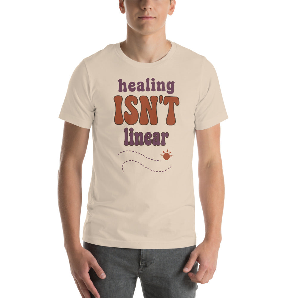 Healing Isn't Linear soft retro mental health tee — Soft Cream, on model