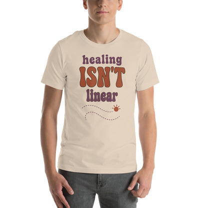 Healing Isn't Linear soft retro mental health tee — Soft Cream, on model