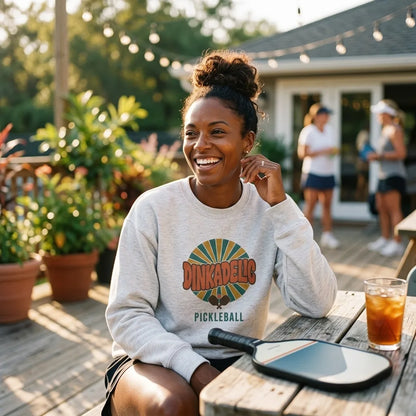 Dinkadelic retro 70s pickleball crewneck sweatshirt patio lifestyle