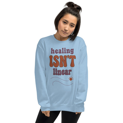 Healing Isn't Linear soft retro mental health crewneck sweatshirt — Light Blue, worn by model