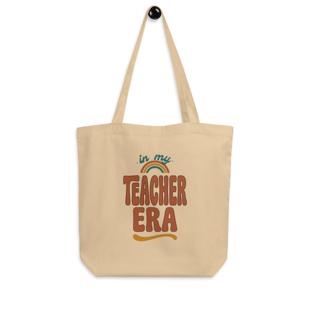 In My Teacher Era retro groovy teacher canvas tote bag — Oyster, hanger