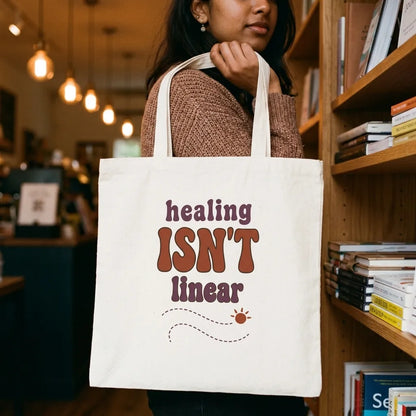 Healing Isn't Linear soft retro mental health cotton tote bag — lifestyle
