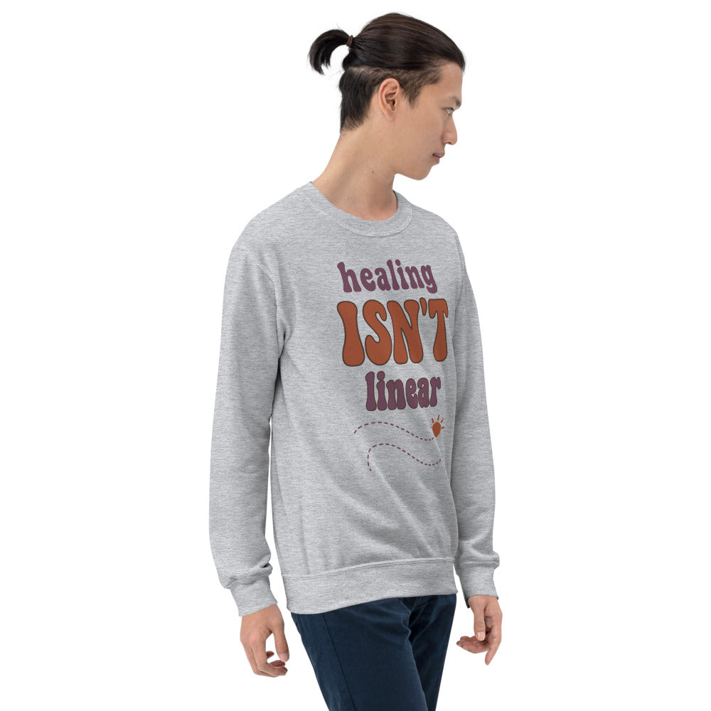 Healing Isn't Linear soft retro mental health crewneck sweatshirt — Sport Grey, worn by model