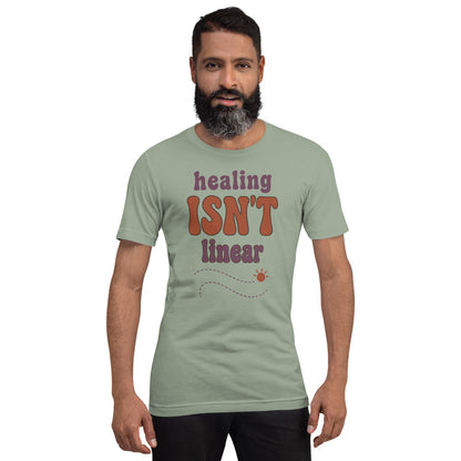 Healing Isn't Linear soft retro mental health tee — Sage, on model