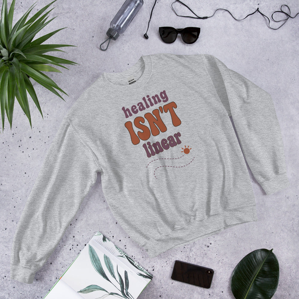 Healing Isn't Linear soft retro mental health crewneck sweatshirt — Sport Grey, front angled