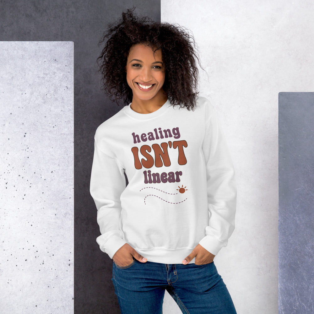 Healing Isn't Linear soft retro mental health crewneck sweatshirt — White, worn by model