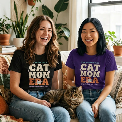 Two friends laughing in Cat Mom Era retro Y2K tees with a tabby cat — Black and Team Purple