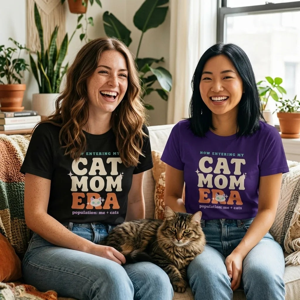 Two friends laughing in Cat Mom Era retro Y2K tees with a tabby cat — Black and Team Purple