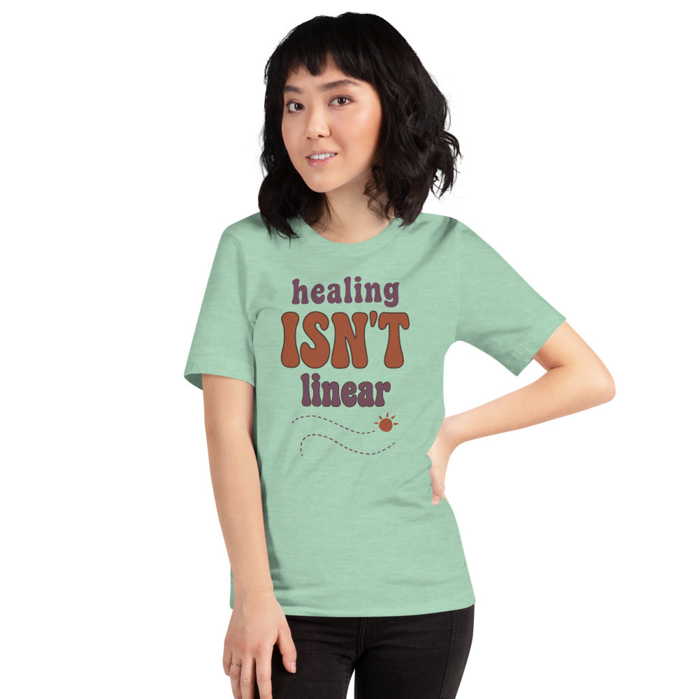 Healing Isn't Linear soft retro mental health tee — Heather Prism Mint, on model