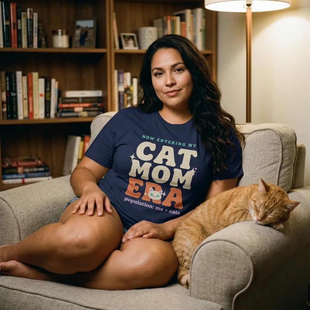 Woman relaxing in a Cat Mom Era retro Y2K Navy tee with an orange cat