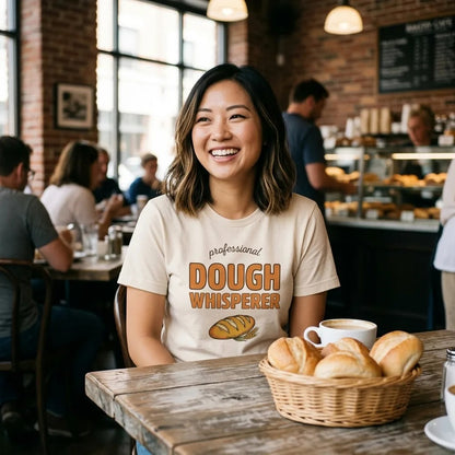 Woman at bakery cafe wearing Professional Dough Whisperer funny baker tee — Sage