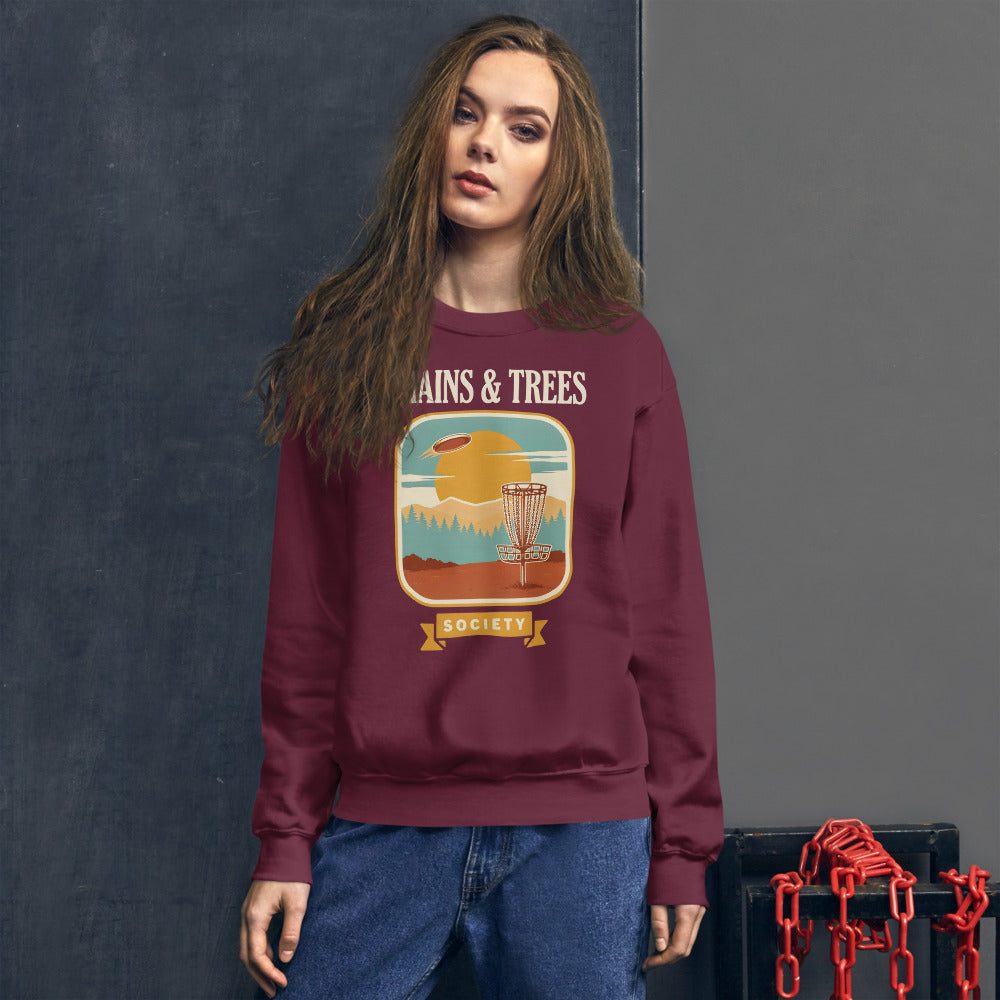 Chains & Trees Society disc golf retro landscape crewneck sweatshirt — Maroon, on model