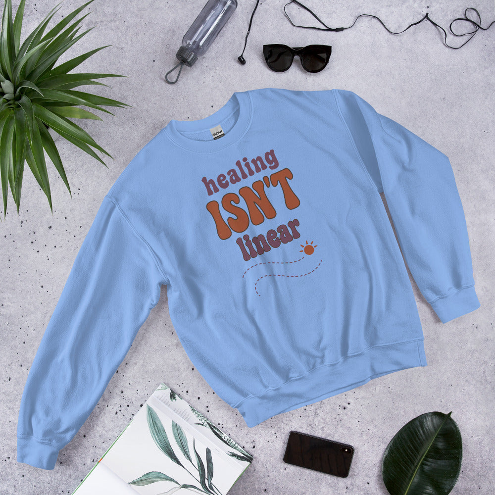 Healing Isn't Linear soft retro mental health crewneck sweatshirt — Carolina Blue, front angled