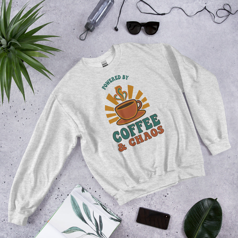 Powered By Coffee And Chaos retro groovy teacher crewneck sweatshirt — Ash, front view