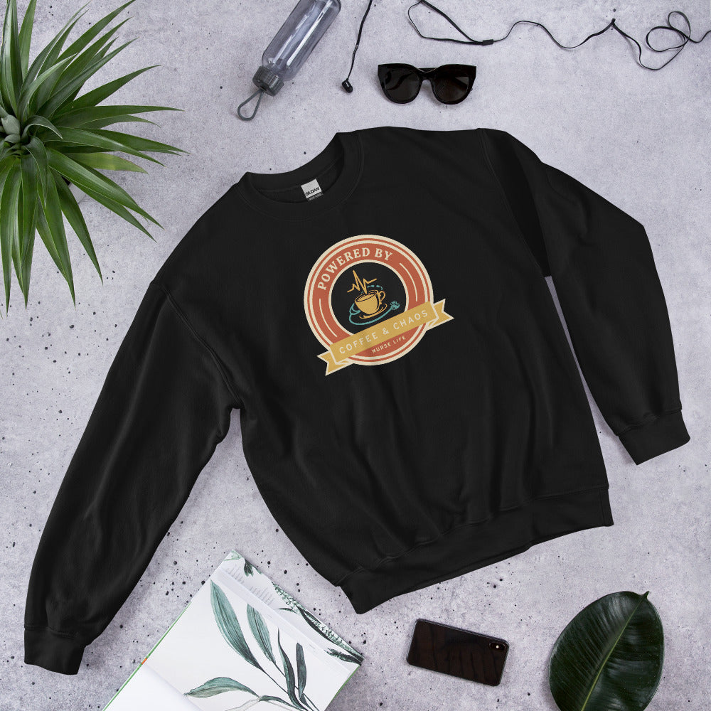 Powered by Coffee & Chaos retro nurse badge crewneck sweatshirt — Black, front-right