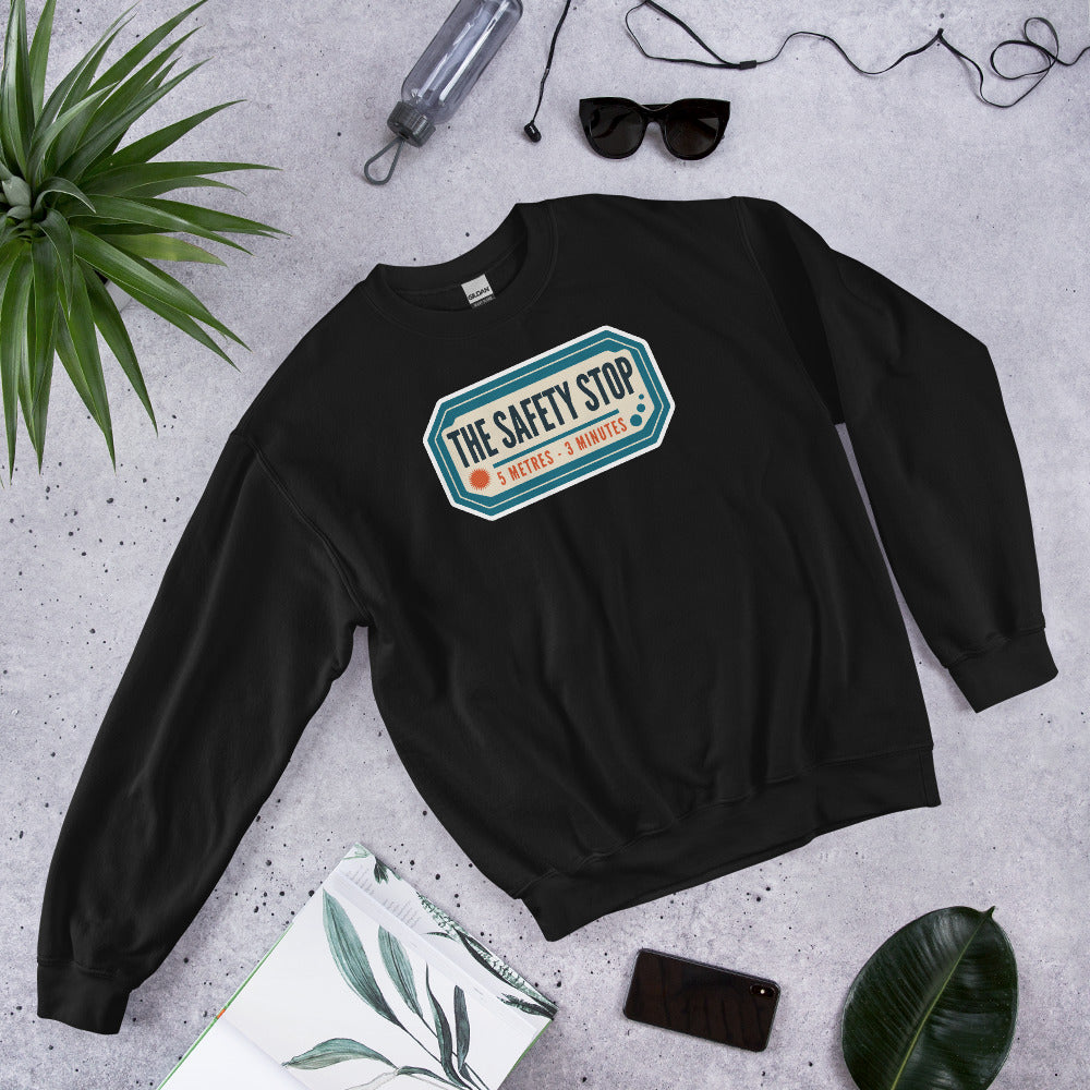 The Safety Stop vintage scuba diving travel decal sweatshirt — Black, flat lay