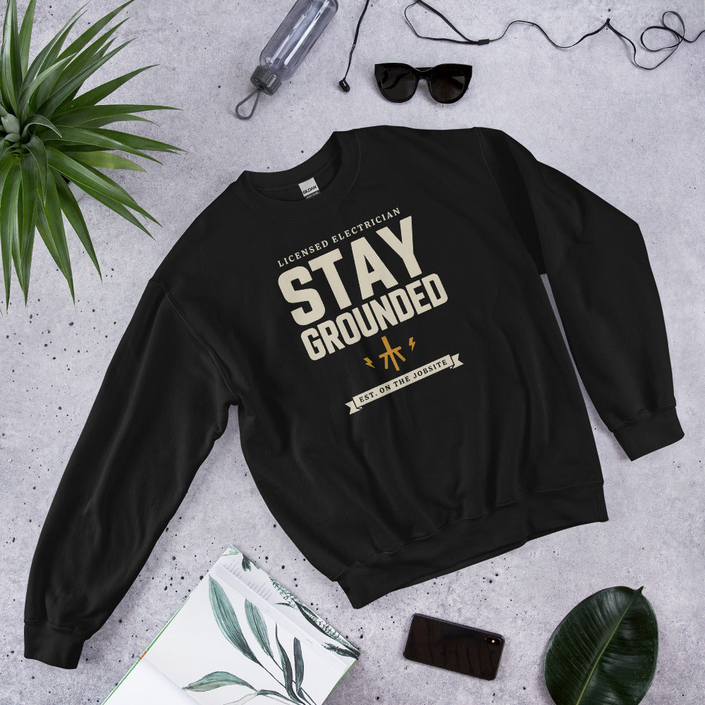 Stay Grounded funny electrician crewneck — Black, flat lay