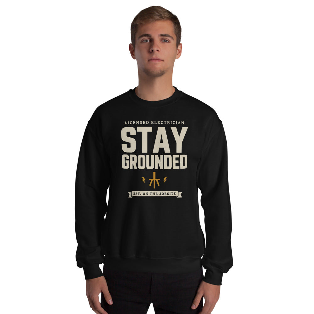 Stay Grounded funny electrician crewneck — Black, on model