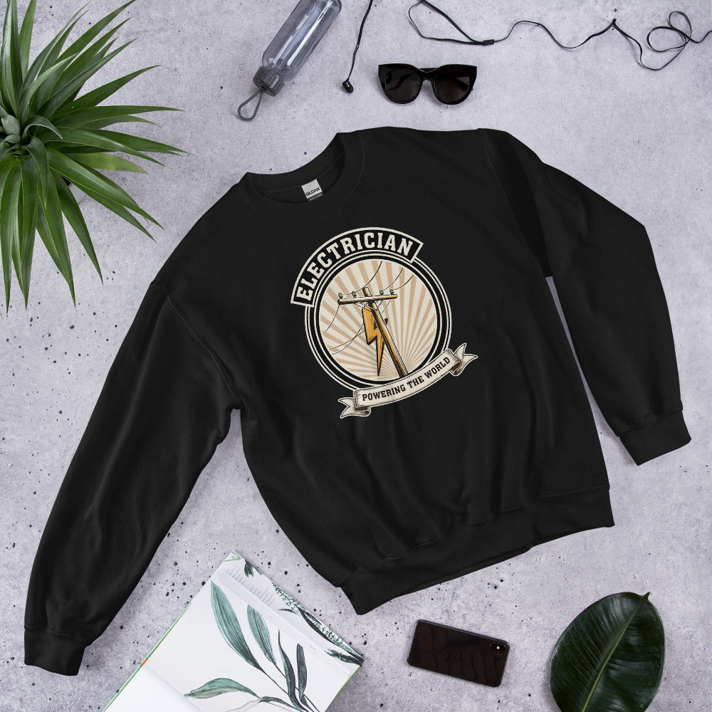 Powering The World electrician emblem crewneck — Black, flat lay