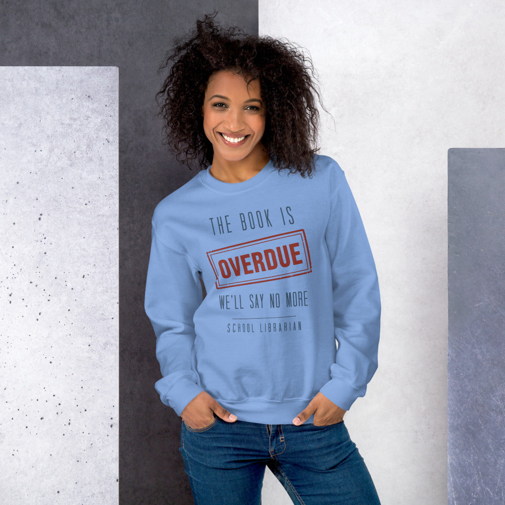 The Book Is Overdue funny school librarian crewneck sweatshirt — Carolina Blue, on model