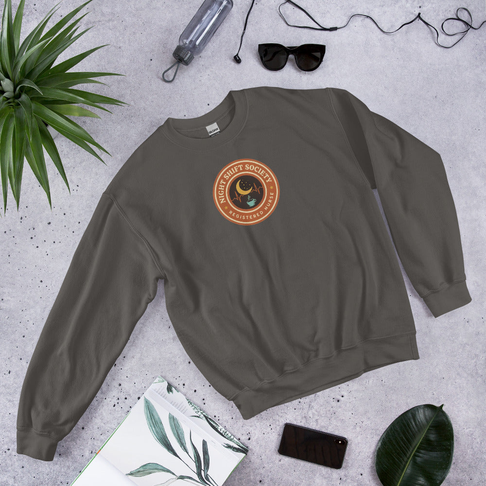 Night Shift Society retro registered nurse badge crewneck sweatshirt — Charcoal, front-right