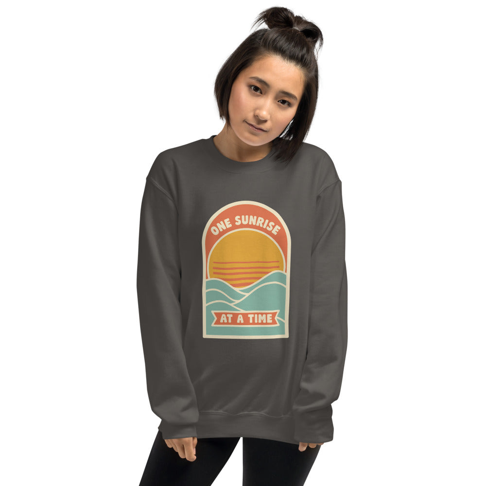 One Sunrise at a Time retro sunrise crewneck sweatshirt — Charcoal, on model