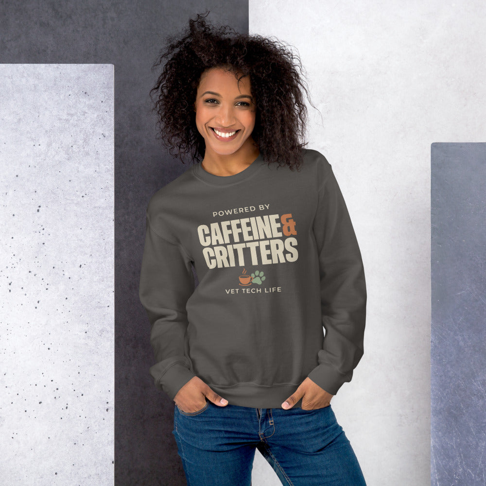 Powered by Caffeine & Critters funny vet tech crewneck sweatshirt — Charcoal, on model
