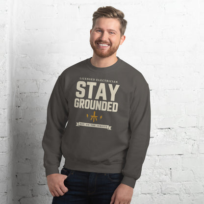 Stay Grounded funny electrician crewneck — Charcoal, on model