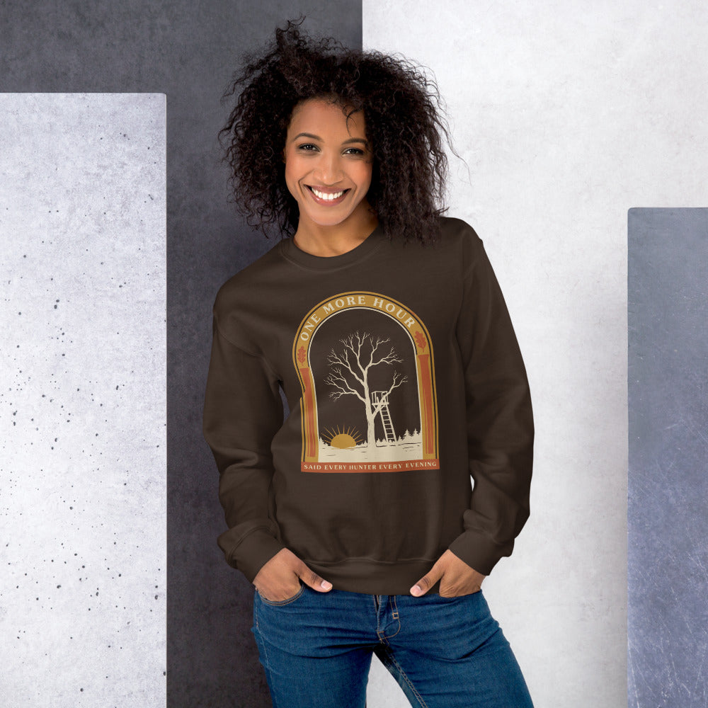 One More Hour funny deer hunting crewneck — Dark Chocolate, on model