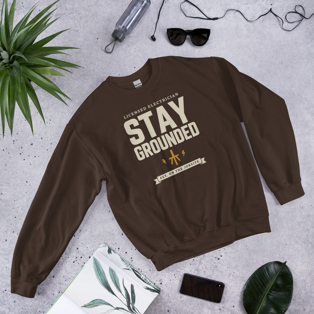 Stay Grounded funny electrician crewneck — Dark Chocolate, flat lay