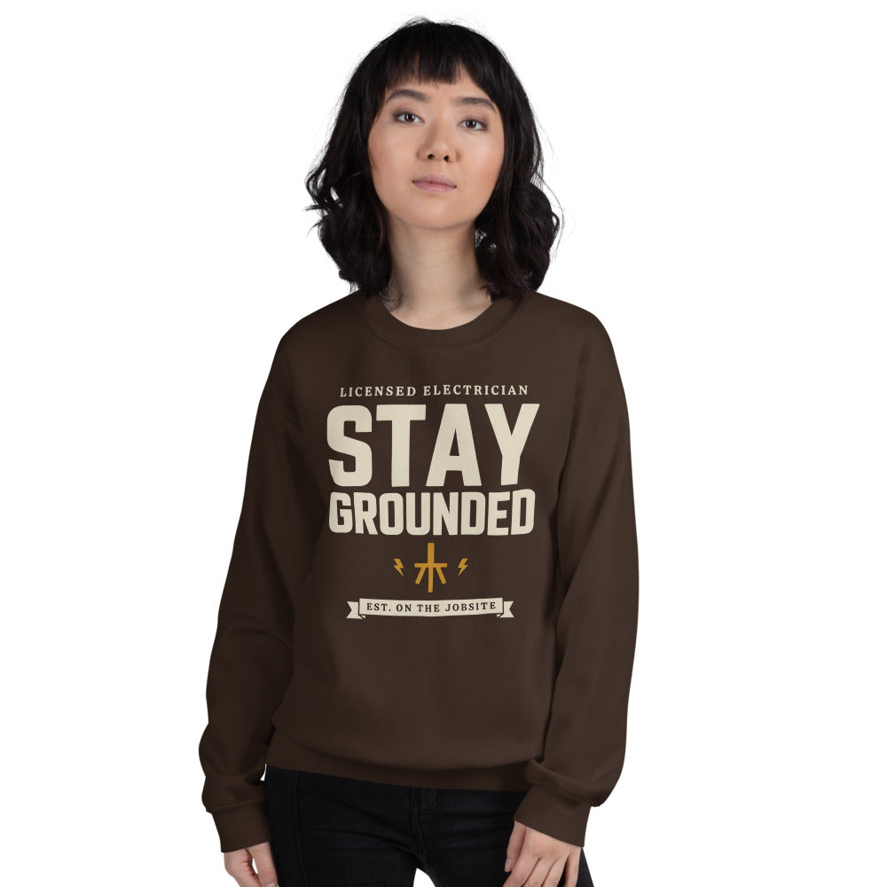 Stay Grounded funny electrician crewneck — Dark Chocolate, on model