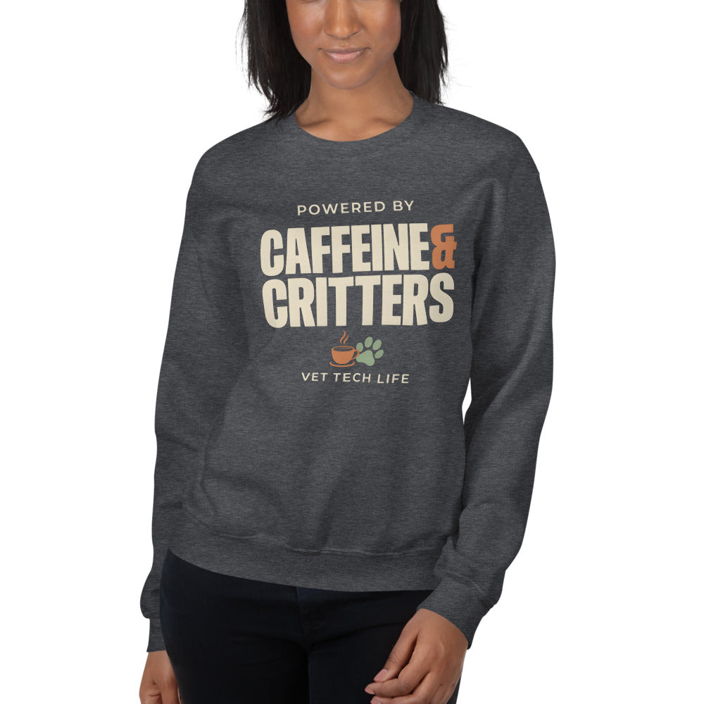Powered by Caffeine & Critters funny vet tech crewneck sweatshirt — Dark Heather, on model