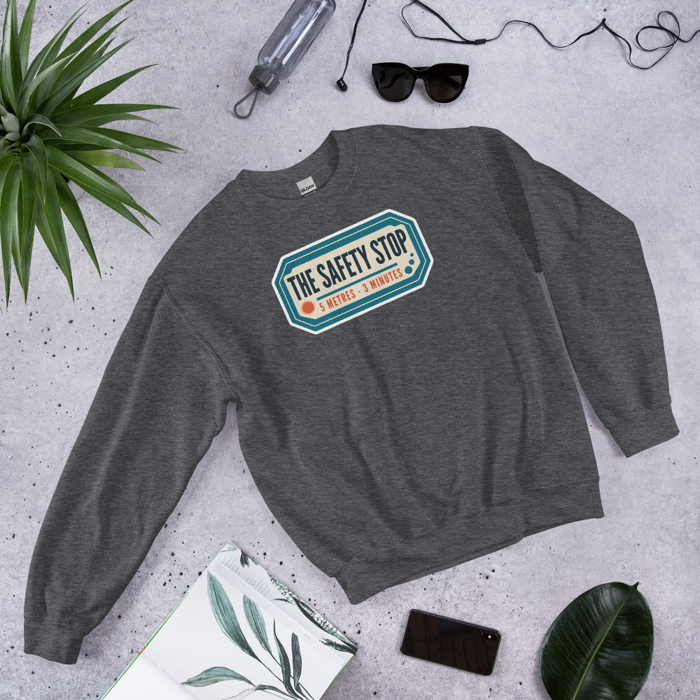 The Safety Stop vintage scuba diving travel decal sweatshirt — Dark Heather, flat lay