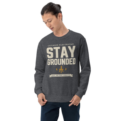 Stay Grounded funny electrician crewneck — Dark Heather, on model