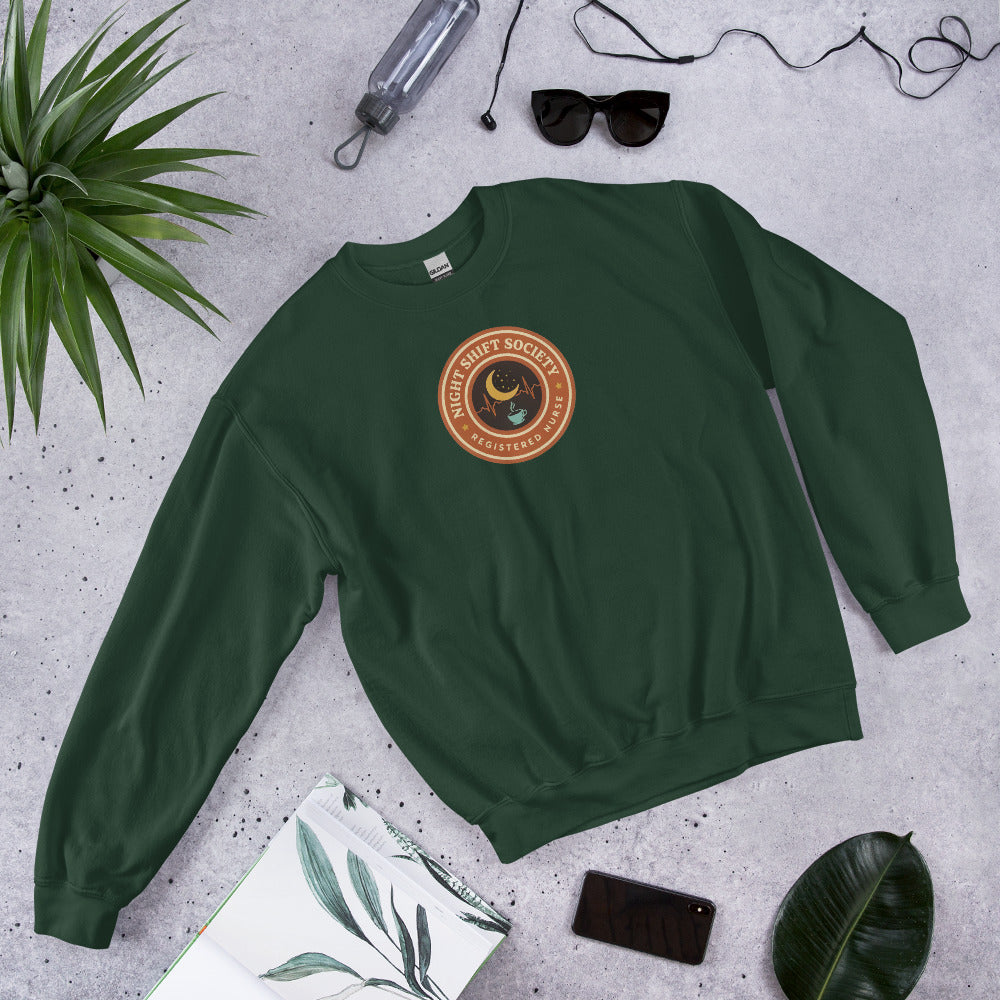 Night Shift Society retro registered nurse badge crewneck sweatshirt — Forest Green, front-right