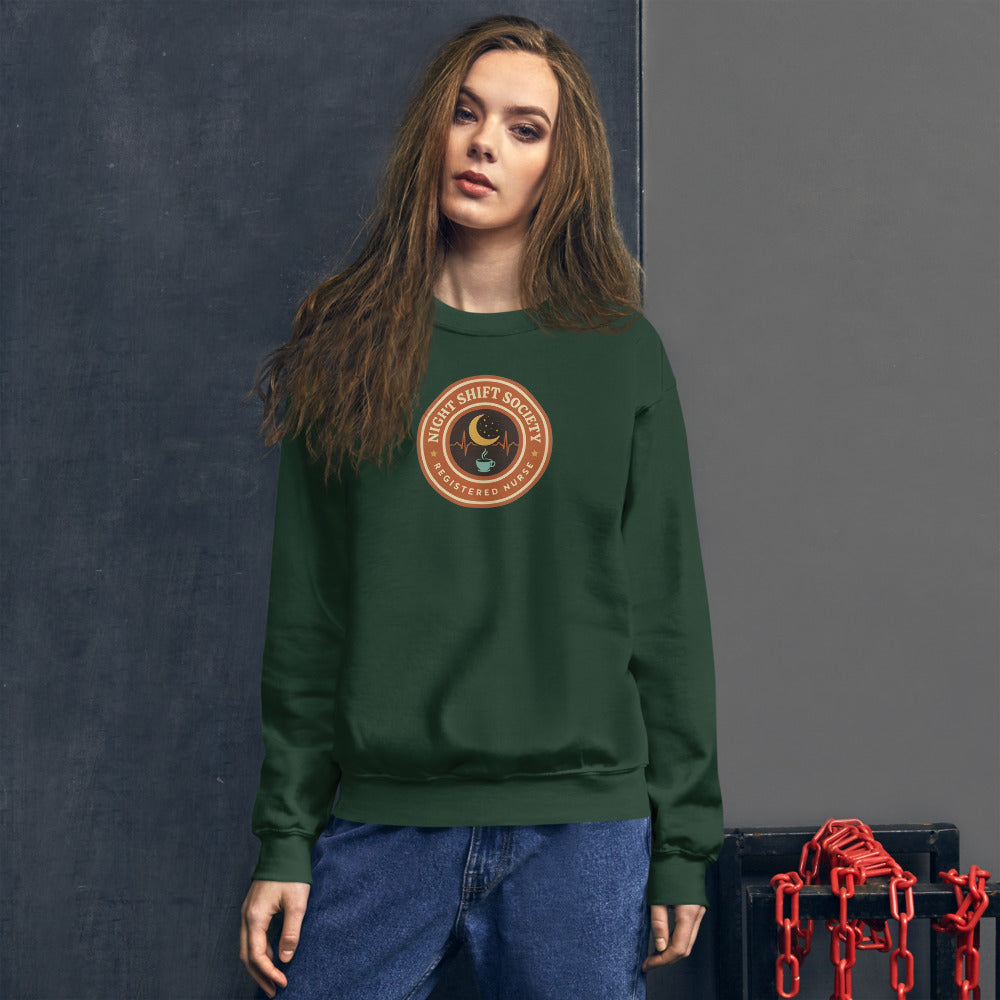 Night Shift Society retro registered nurse badge crewneck sweatshirt — Forest Green, on model