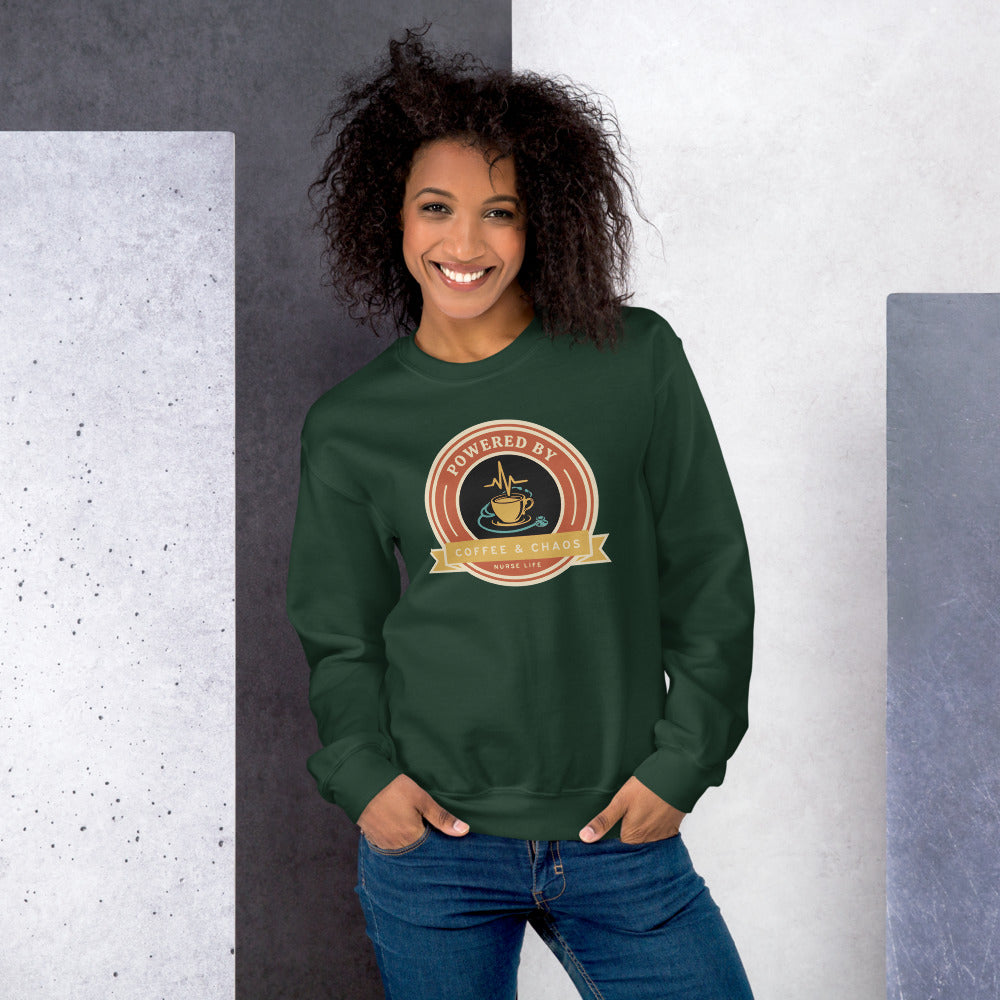 Powered by Coffee & Chaos retro nurse badge crewneck sweatshirt — Forest Green, on model