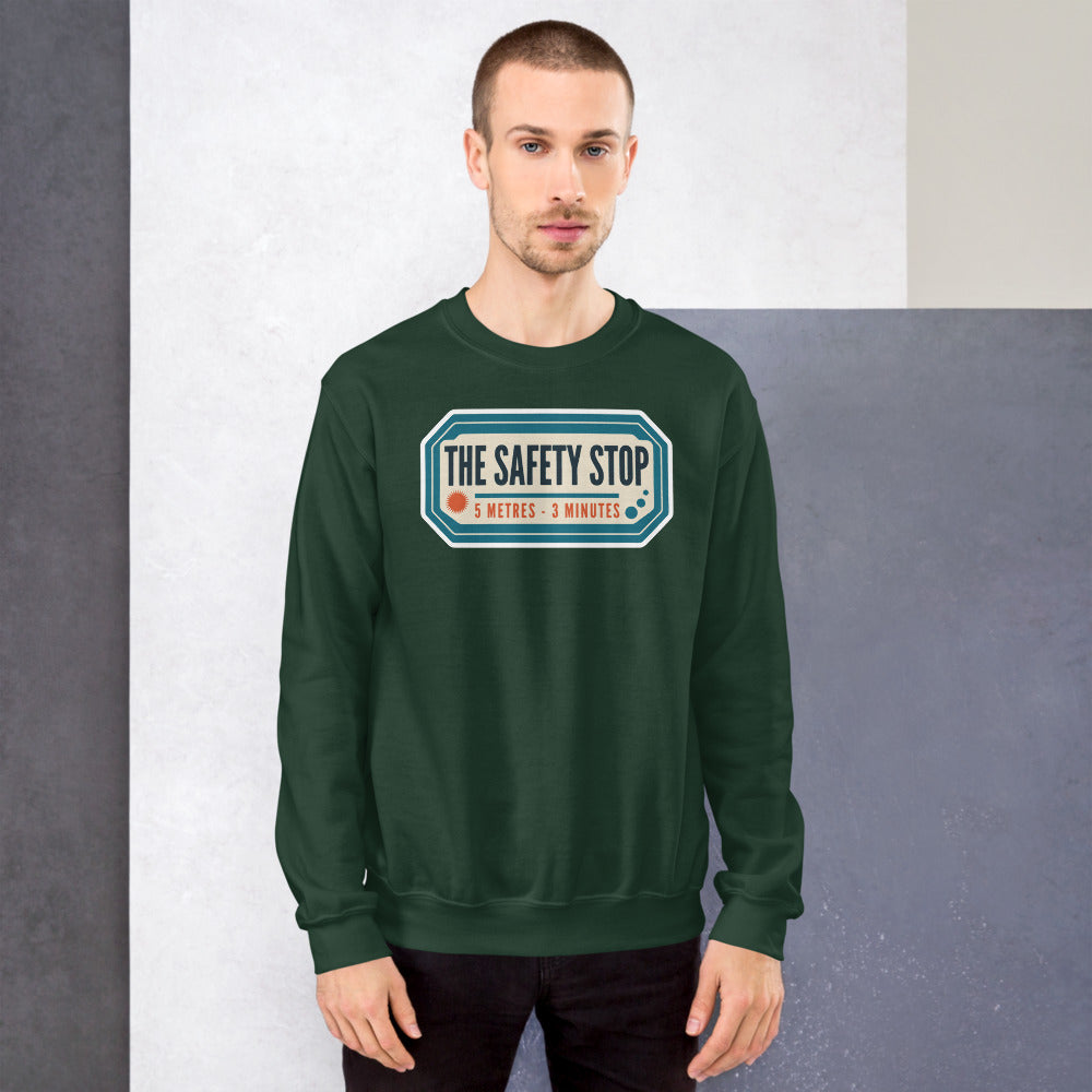 The Safety Stop vintage scuba diving travel decal sweatshirt — Forest Green, on model