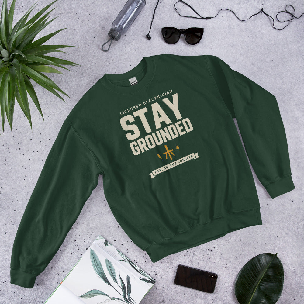 Stay Grounded funny electrician crewneck — Forest Green, flat lay