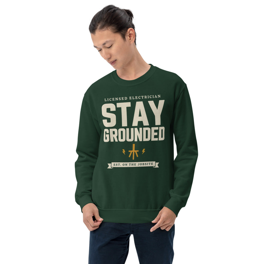 Stay Grounded funny electrician crewneck — Forest Green, on model